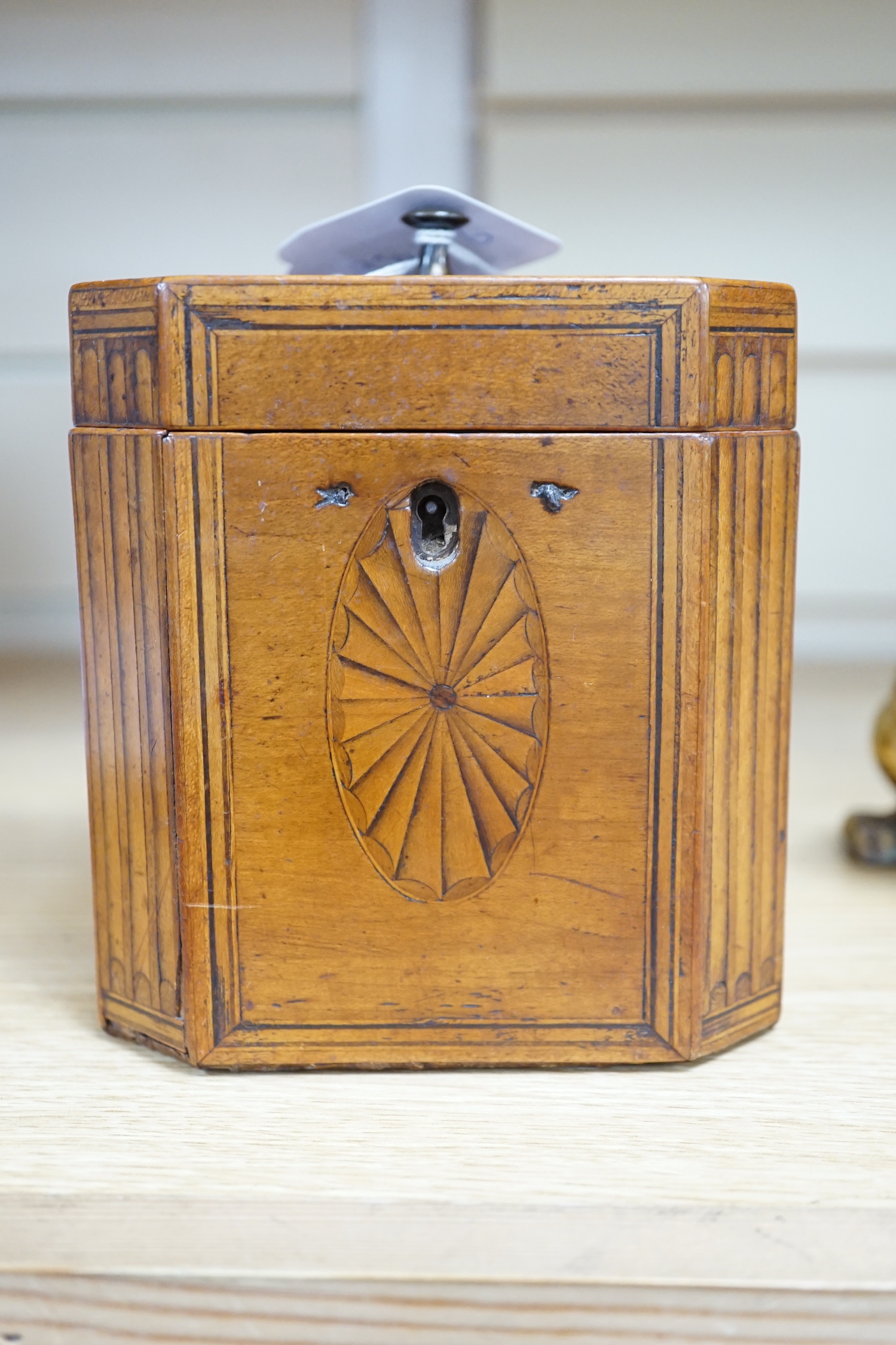 A George III octagonal shell marquetry tea caddy, 12.5cm high